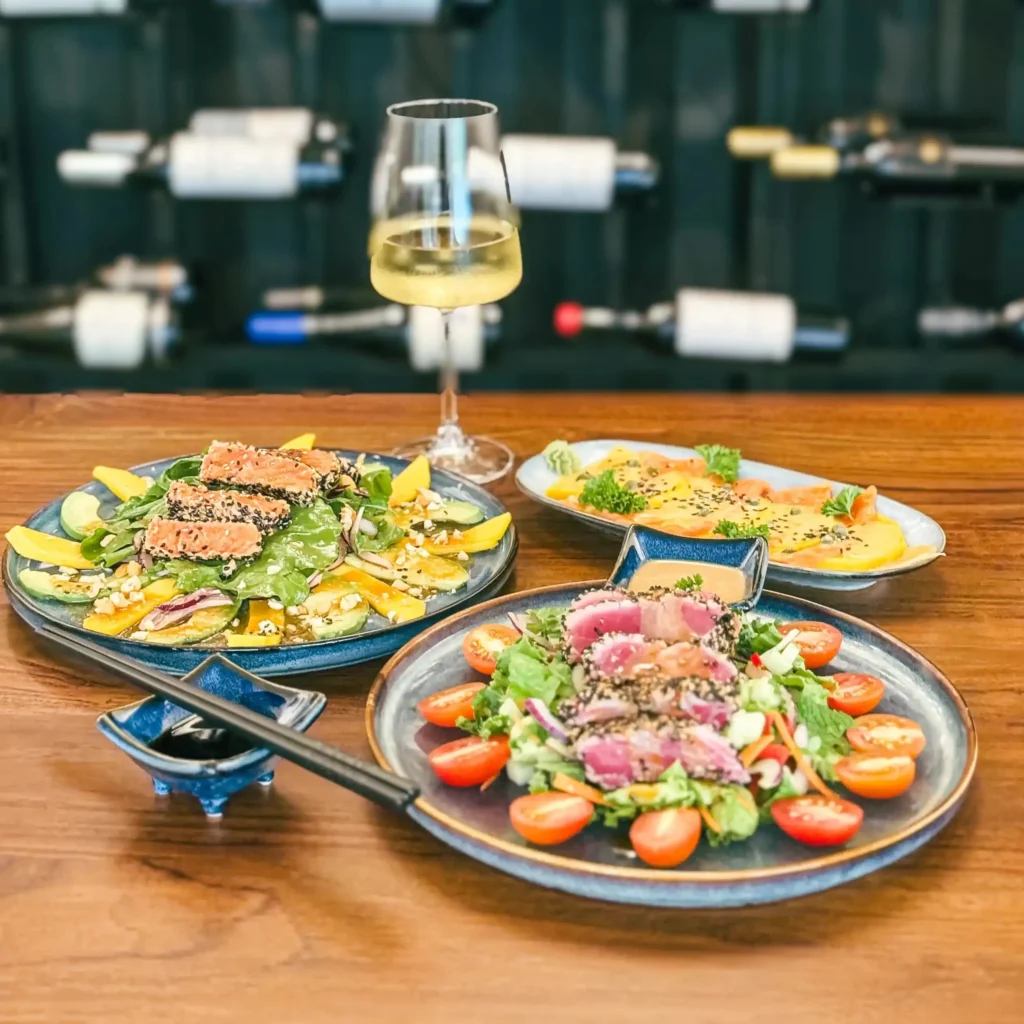 Fine dining sashimi tuna salad plates restaurant setting