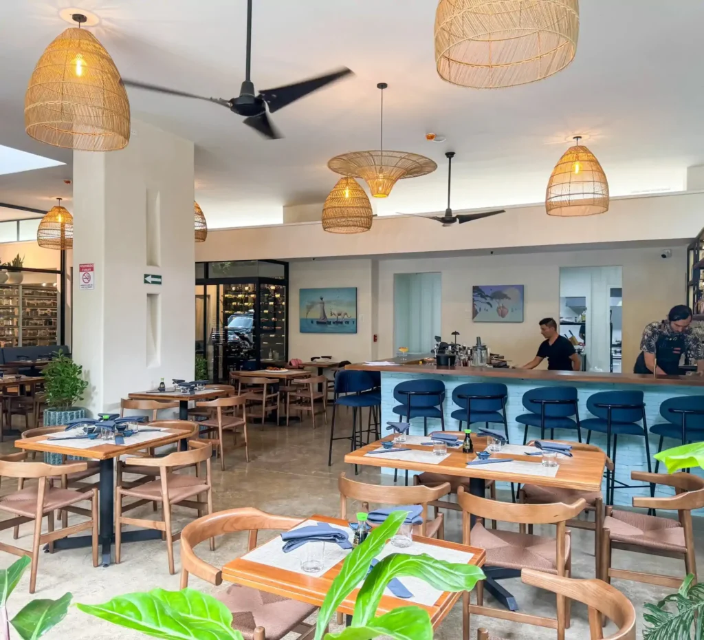 Upscale restaurant interior with tropical design elements