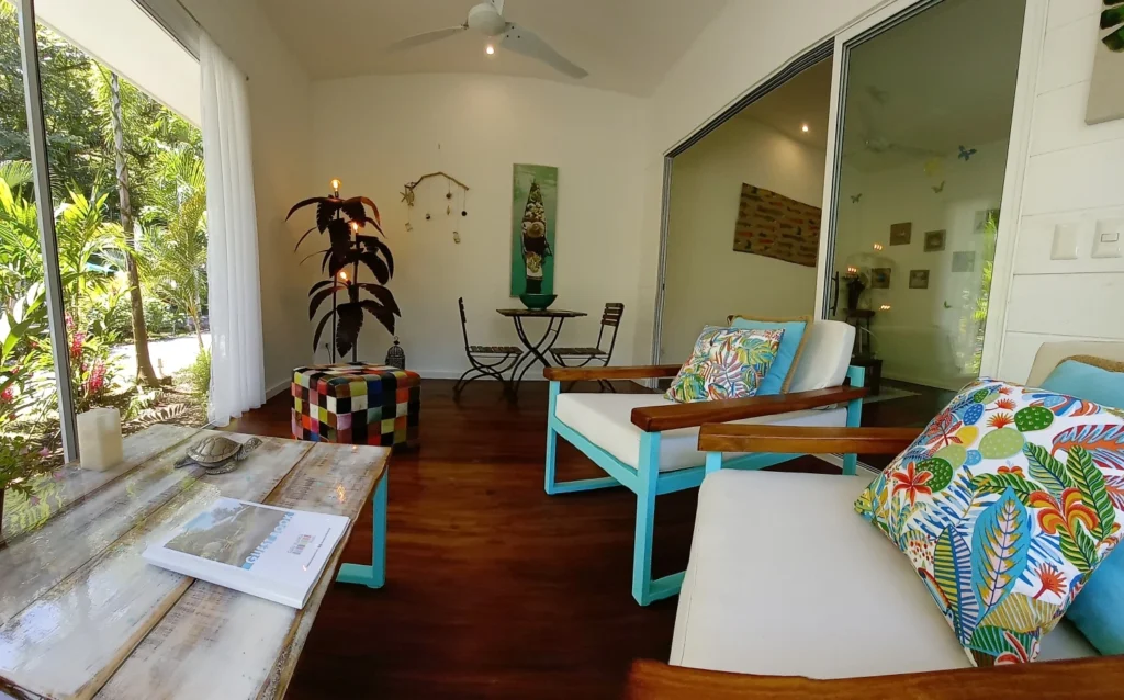 Covered outdoor living with tropical furnishings