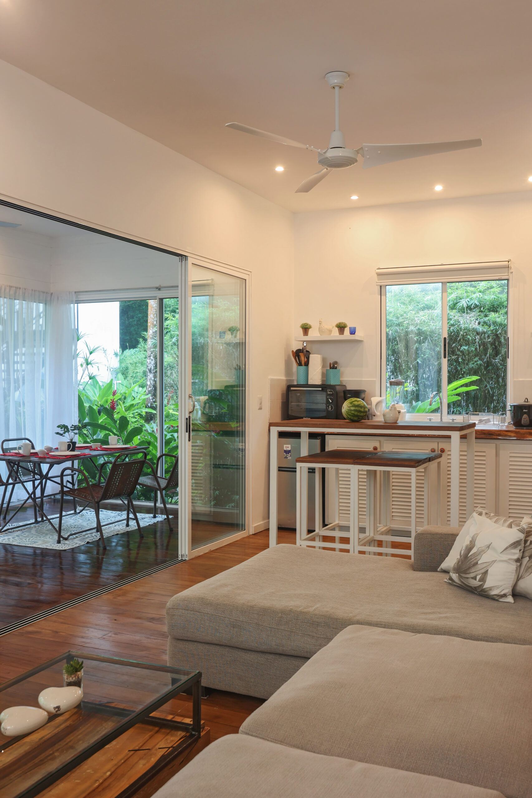 Contemporary Tropical Home with Modern Steel Staircase and Wooden Deck