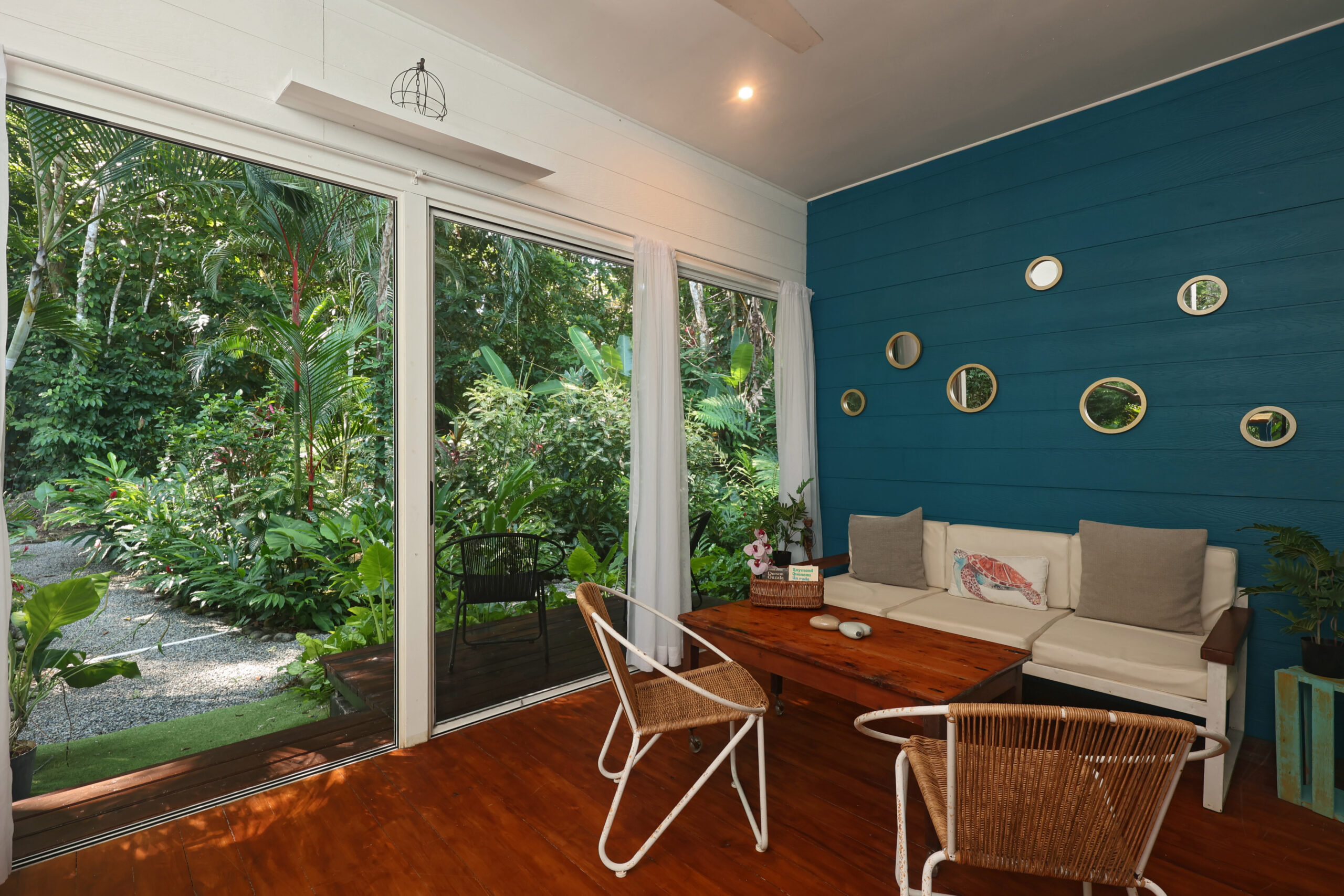 Resort dining room with garden views, modern furniture & tropical style