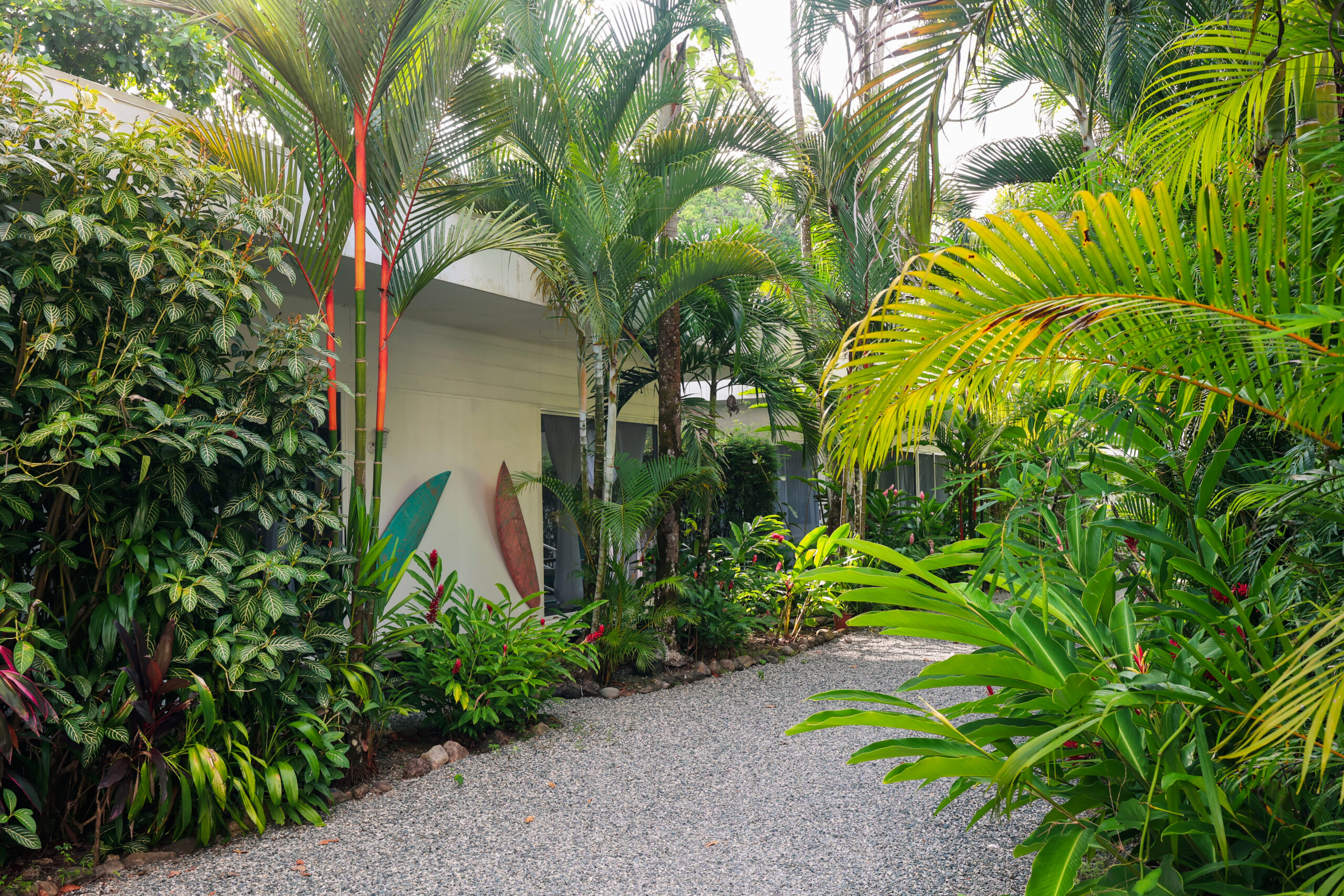 Stylish dining room with teal chairs and decor at Ojochal Gardens Costa Rica villa